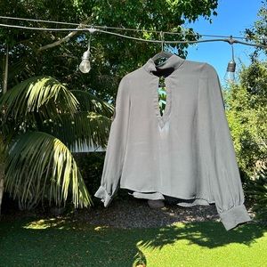 Black long sleeve top with slit in front